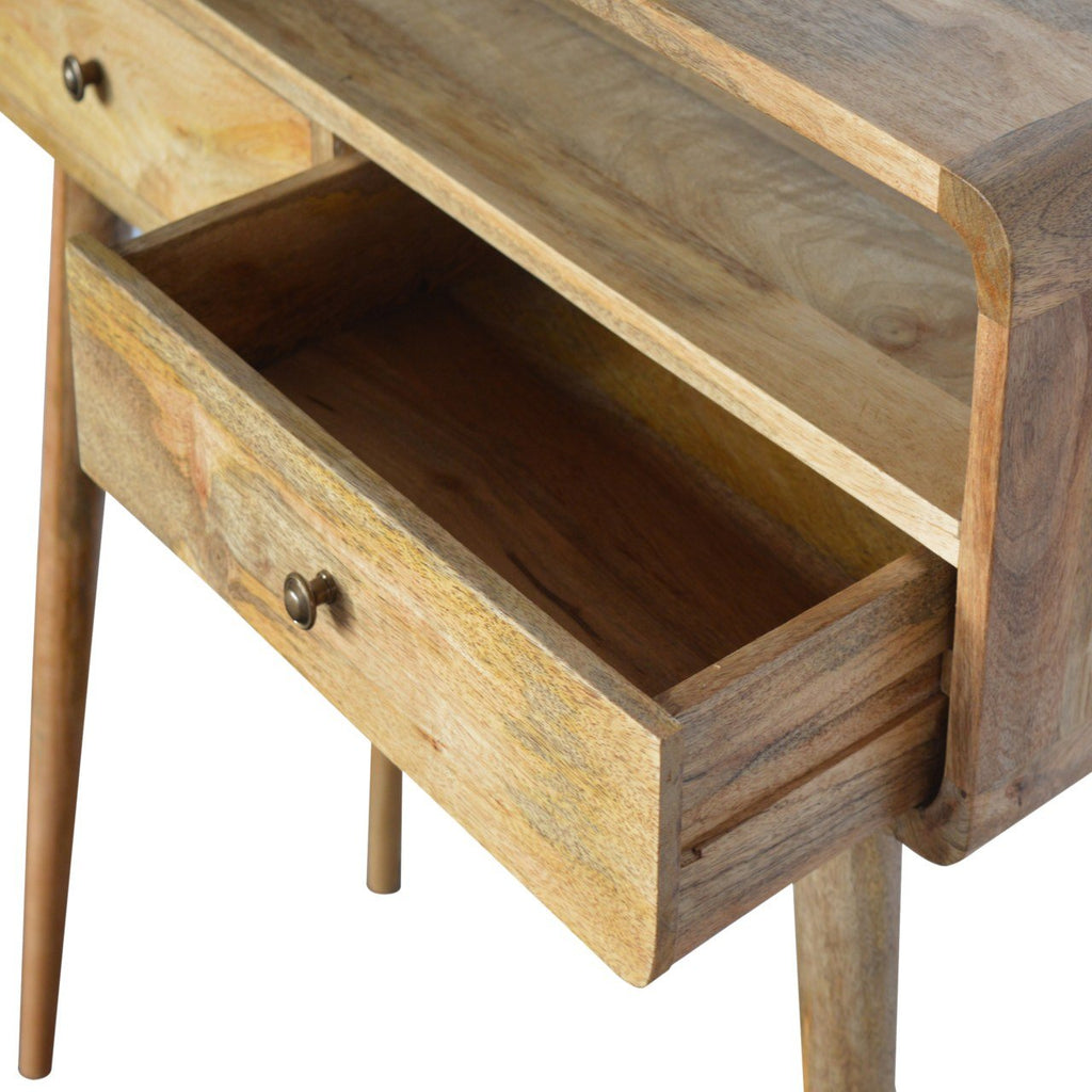 Curved mango wood console table in hallway interior